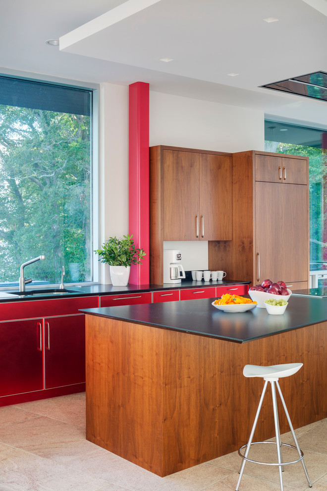 This is an example of a contemporary kitchen in Boston with a drop-in sink, flat-panel cabinets, red cabinets, stainless steel appliances and with island.