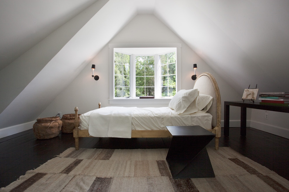 Photo of a country bedroom in Philadelphia with white walls and dark hardwood floors.