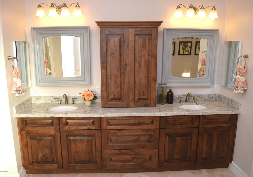 Inspiration for a mid-sized transitional master beige tile and stone tile travertine floor double shower remodel in Phoenix with an undermount sink, raised-panel cabinets, dark wood cabinets, granite countertops, a two-piece toilet and beige walls
