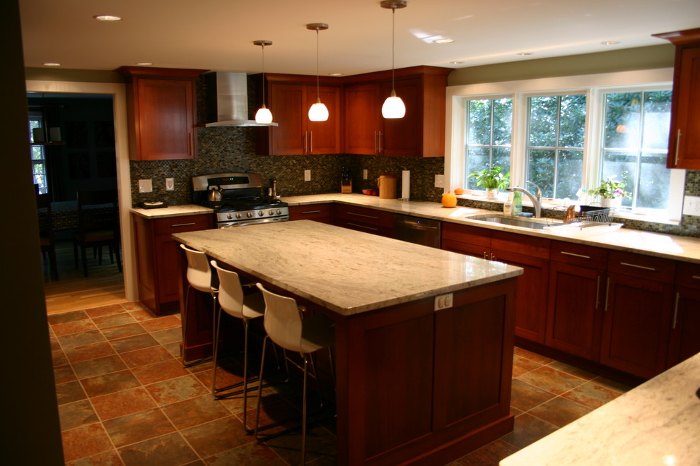 Eat-in kitchen - large transitional u-shaped eat-in kitchen idea in Boston with an island, a single-bowl sink, shaker cabinets, dark wood cabinets, stainless steel appliances and granite countertops