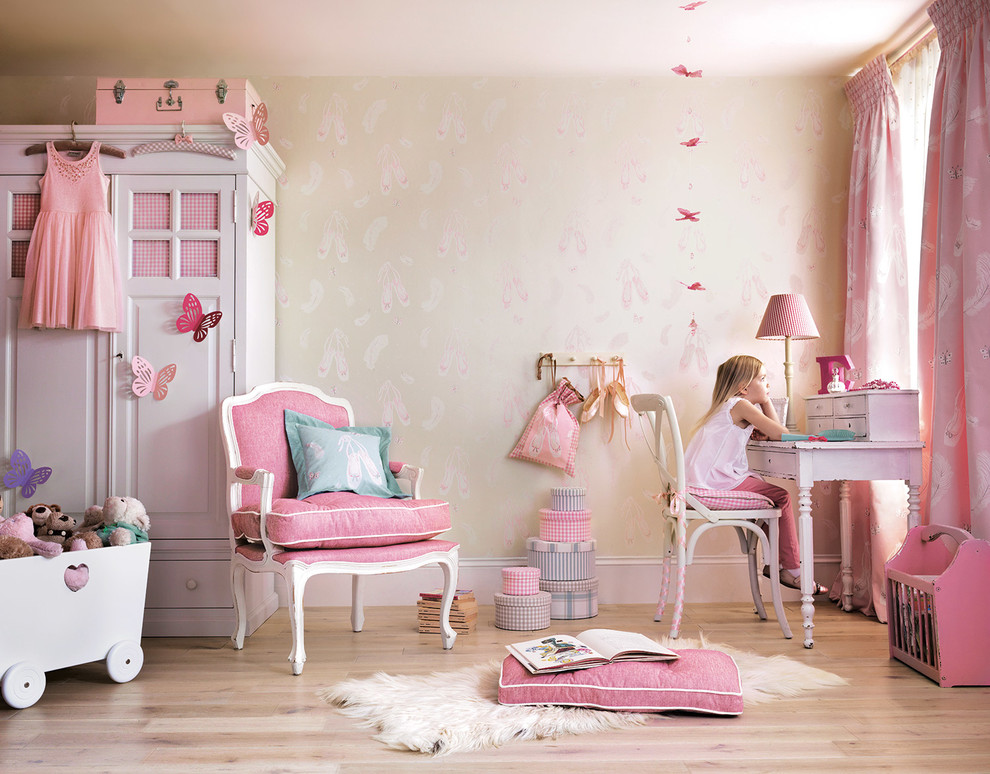 Design ideas for a traditional kids' room for girls in London with multi-coloured walls, light hardwood floors and beige floor.