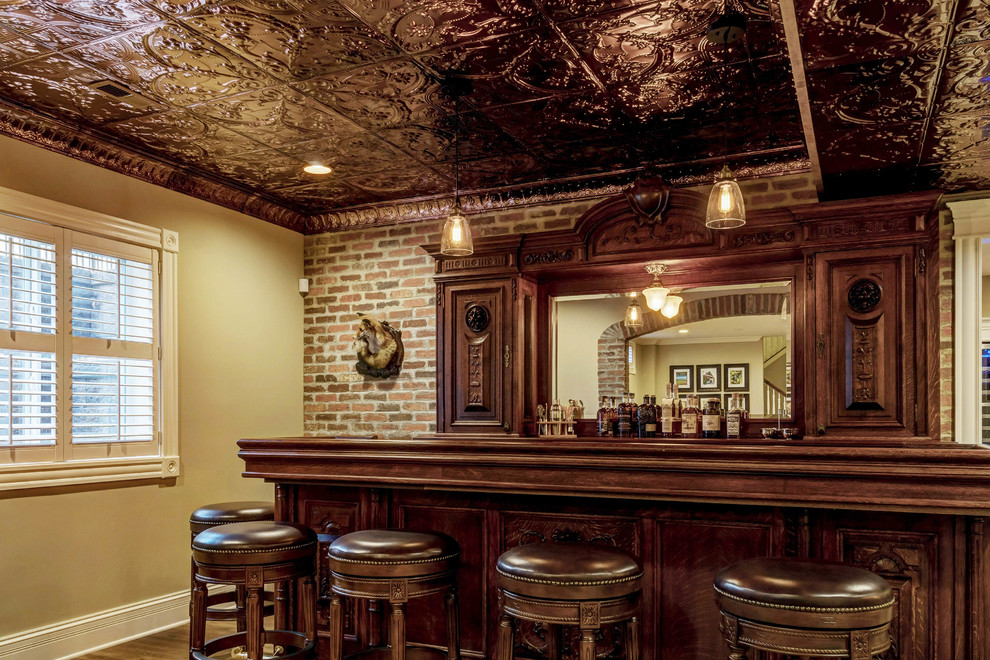 This is an example of a small country home bar in Other.