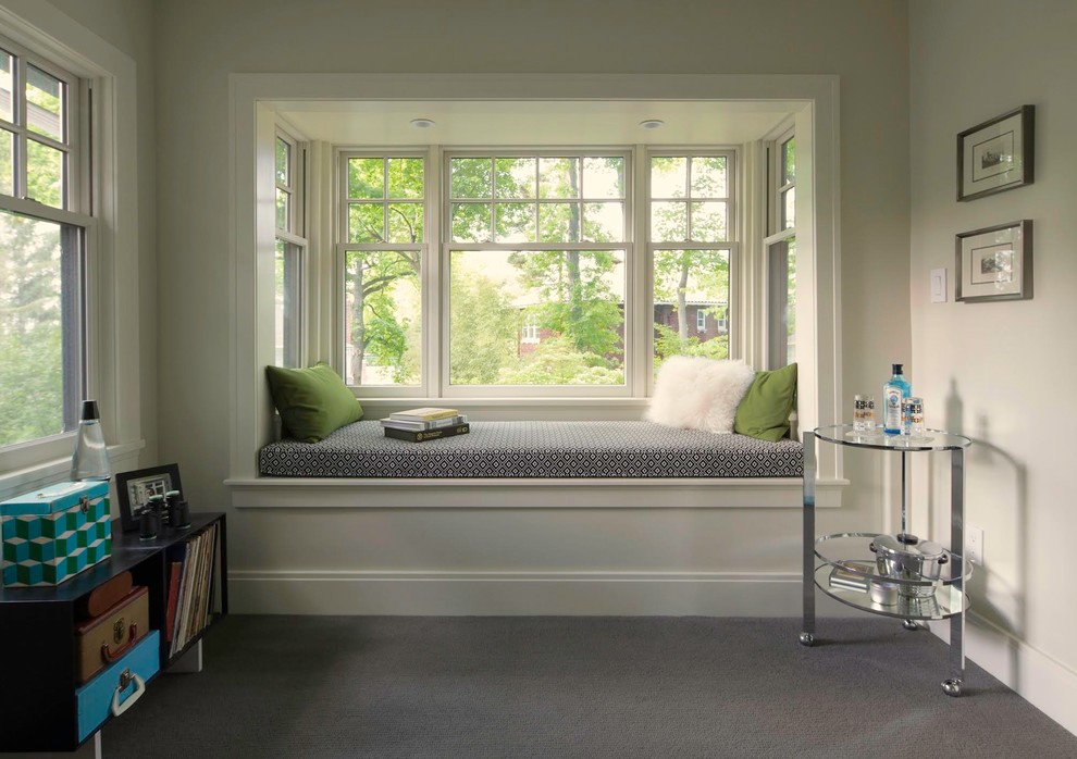 This is an example of a mid-sized transitional master bedroom in New York with white walls, carpet and grey floor.