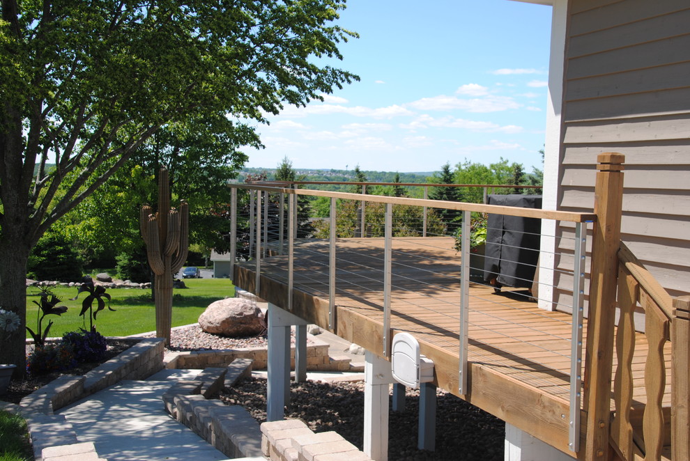 Inspiration for a mid-sized midcentury backyard deck in Milwaukee with with dock and no cover.