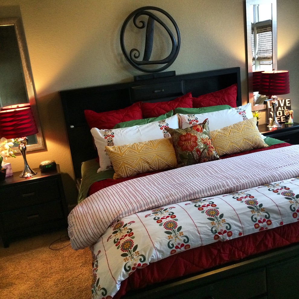 Example of a large transitional master carpeted bedroom design with beige walls and no fireplace