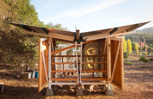 This is one of the most unique coops we've seen, with a modular design that opens up on the sides for full access and fresh air. The V-shaped roof channels water away from the birds.