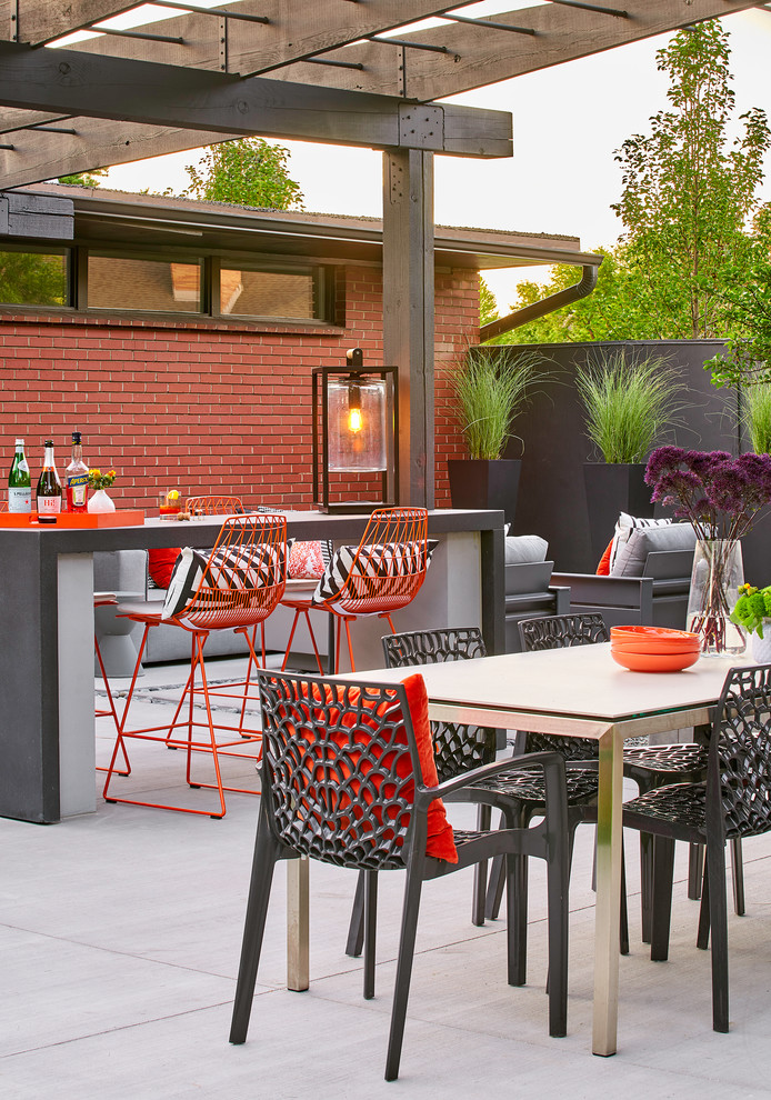 This is an example of a midcentury patio in Denver.