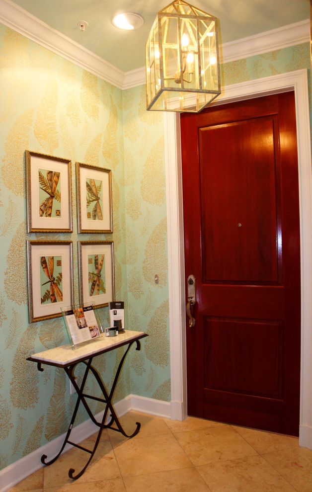 Mid-sized beach style vestibule in Miami with green walls, travertine floors, a single front door and a dark wood front door.