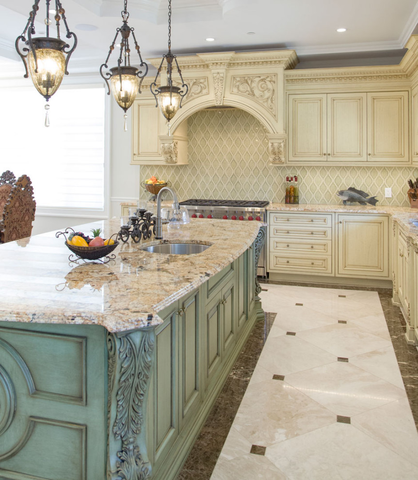 Photo of a large traditional l-shaped eat-in kitchen in New York with an integrated sink, shaker cabinets, beige cabinets, quartz benchtops, beige splashback, coloured appliances, with island, white floor and beige benchtop.