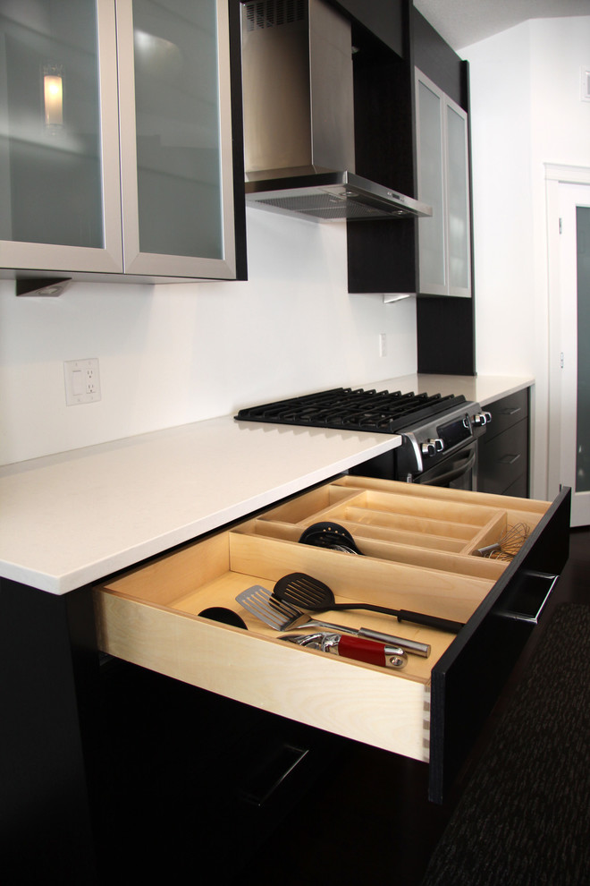 Inspiration for a small modern u-shaped kitchen pantry remodel with an island