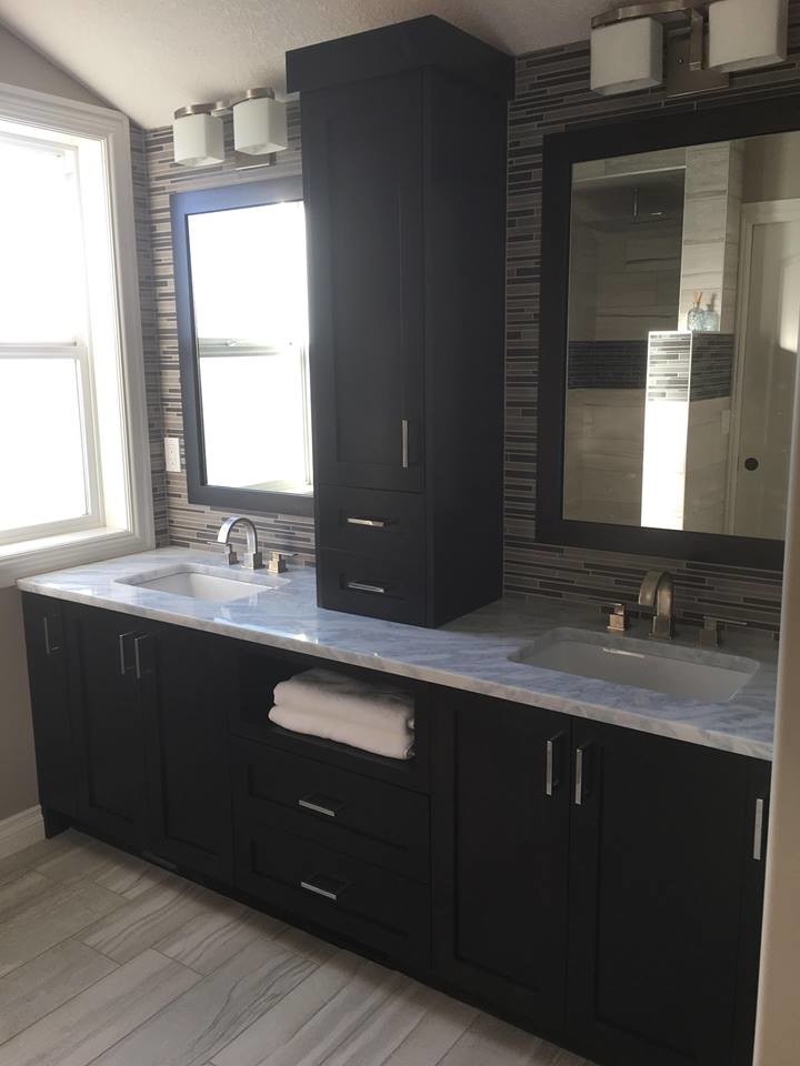 Example of a mid-sized transitional master multicolored tile and matchstick tile vinyl floor alcove shower design with shaker cabinets, black cabinets, gray walls, an undermount sink and marble countertops