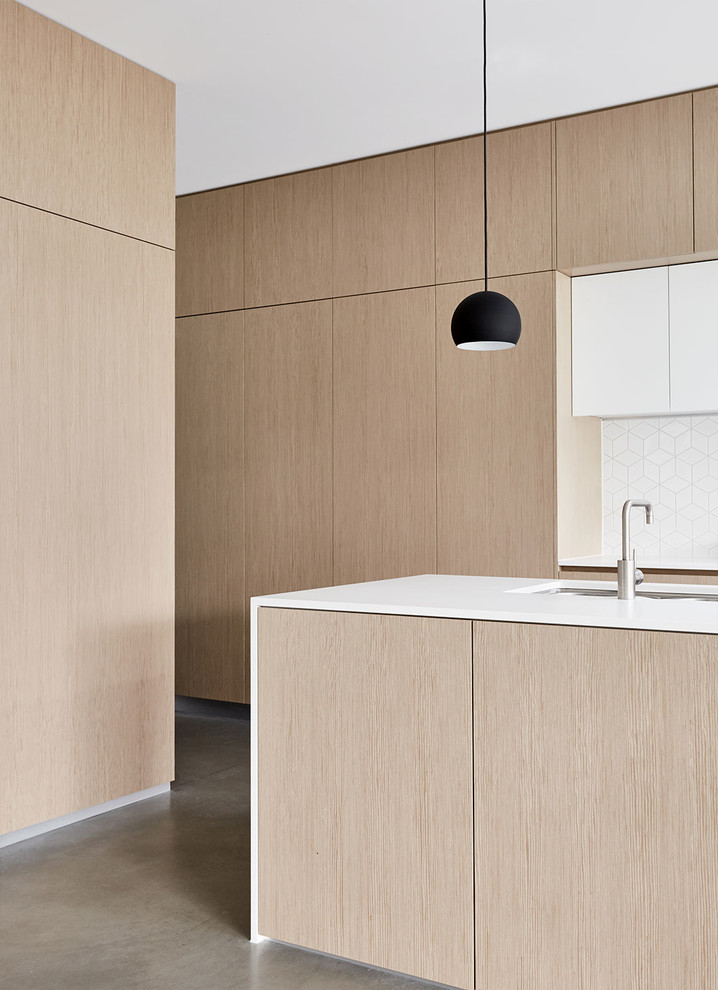 Inspiration for a modern eat-in kitchen in Melbourne with with island and ceramic splashback.