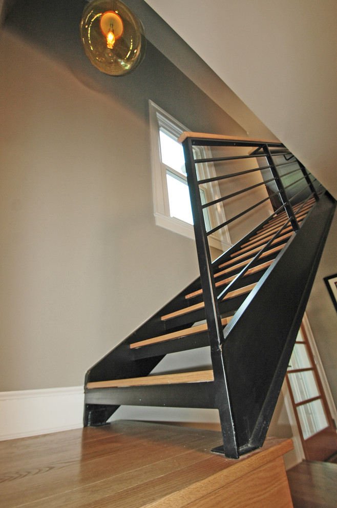 Mid-sized trendy wooden l-shaped staircase photo in Other with metal risers