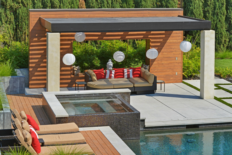 Photo of an expansive contemporary backyard patio in San Francisco with a pergola and concrete pavers.