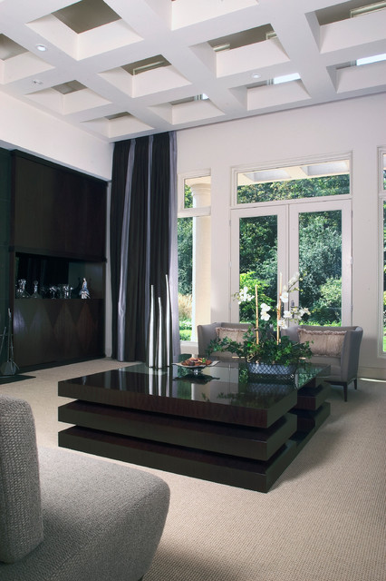 Living Room With Floor To Ceiling Windows And Coffer Ceiling