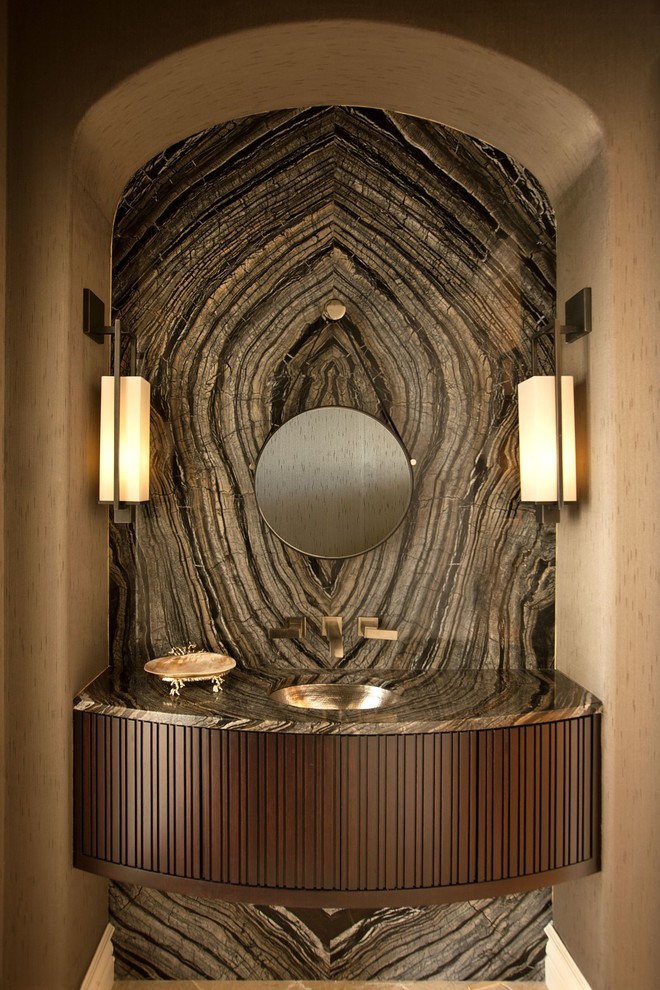 This is an example of a large transitional powder room in Miami with an undermount sink, dark wood cabinets, brown tile, stone slab, a one-piece toilet, beige walls and dark hardwood floors.