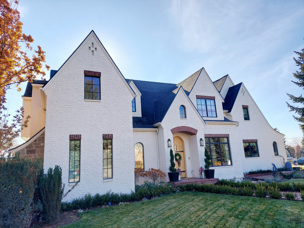 Inspiration for a french country white brick exterior home remodel in Salt Lake City