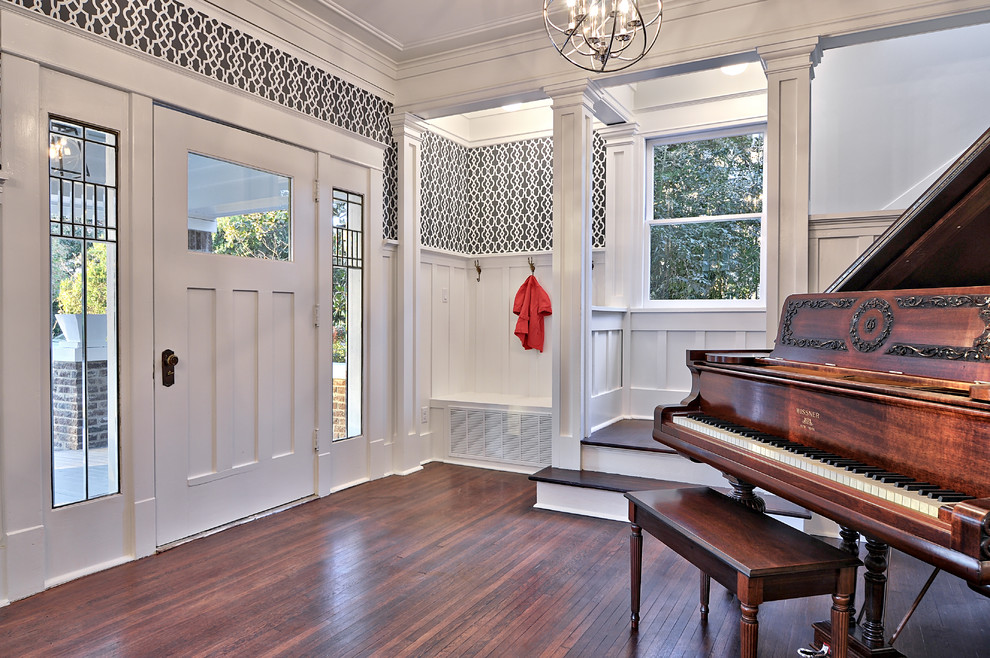 Inspiration for a traditional entryway in Austin with dark hardwood floors, a single front door and a white front door.