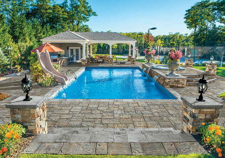 Huge transitional indoor concrete paver and rectangular indoor pool fountain photo