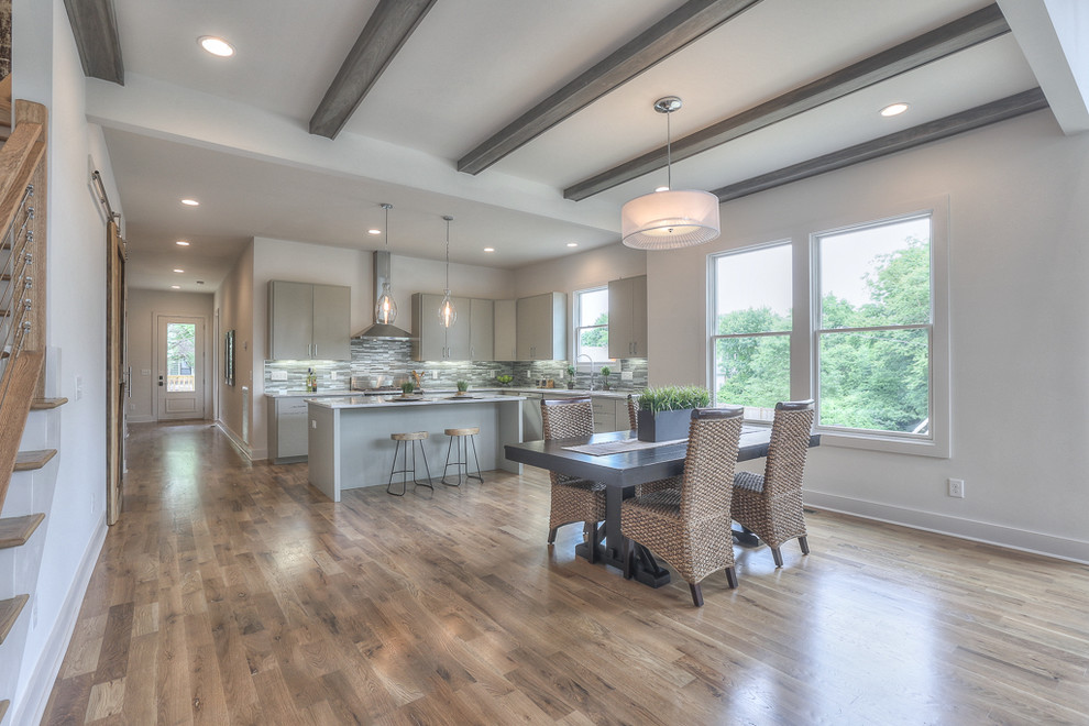 Great room - mid-sized transitional medium tone wood floor great room idea in Nashville with white walls