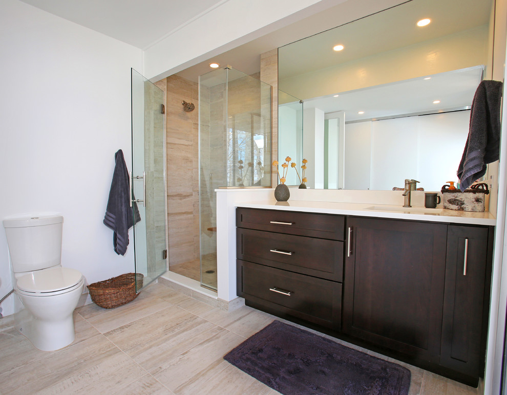 Inspiration for a large contemporary master bathroom in New York with shaker cabinets, dark wood cabinets, a corner shower, an undermount sink, brown tile, porcelain tile, beige walls, porcelain floors, quartzite benchtops, beige floor and a hinged shower door.