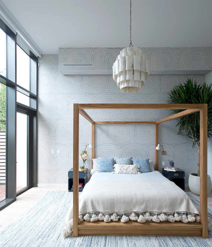 Bedroom - contemporary master light wood floor bedroom idea in New York with multicolored walls
