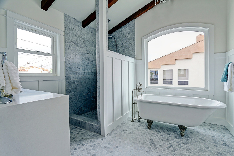 Design ideas for a mid-sized beach style master bathroom in Los Angeles with a claw-foot tub, a corner shower, blue tile, gray tile, subway tile, white walls, white cabinets, marble floors and engineered quartz benchtops.