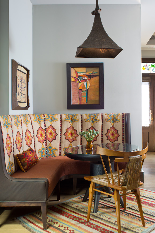 Eclectic dining room in Denver with blue walls.