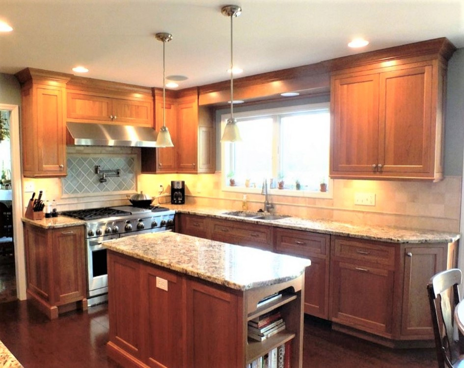 Kitchen - large transitional u-shaped cork floor kitchen idea with beaded inset cabinets, medium tone wood cabinets, granite countertops, blue backsplash, stone tile backsplash, stainless steel appliances and an island