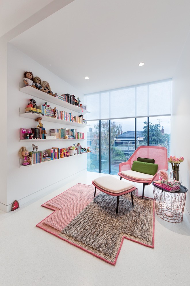 Inspiration for a mid-sized contemporary kids' playroom for girls and kids 4-10 years old in Melbourne with white walls.
