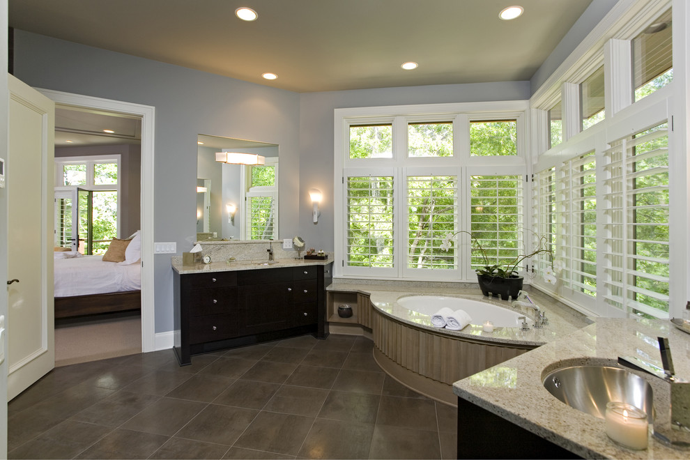 Inspiration for a large traditional master bathroom in Minneapolis with an undermount tub, grey walls, an undermount sink, flat-panel cabinets and dark wood cabinets.