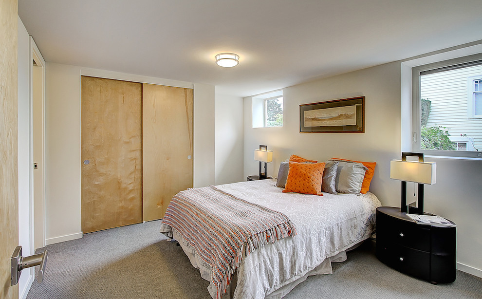 Example of a transitional bedroom design in Seattle