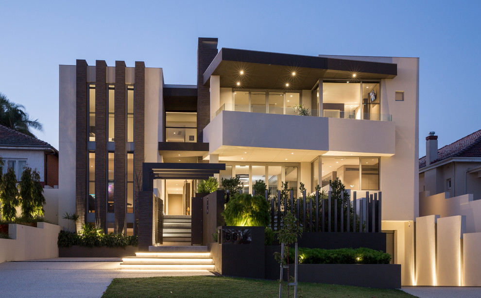 Contemporary three-storey stucco beige house exterior in Other with a flat roof.