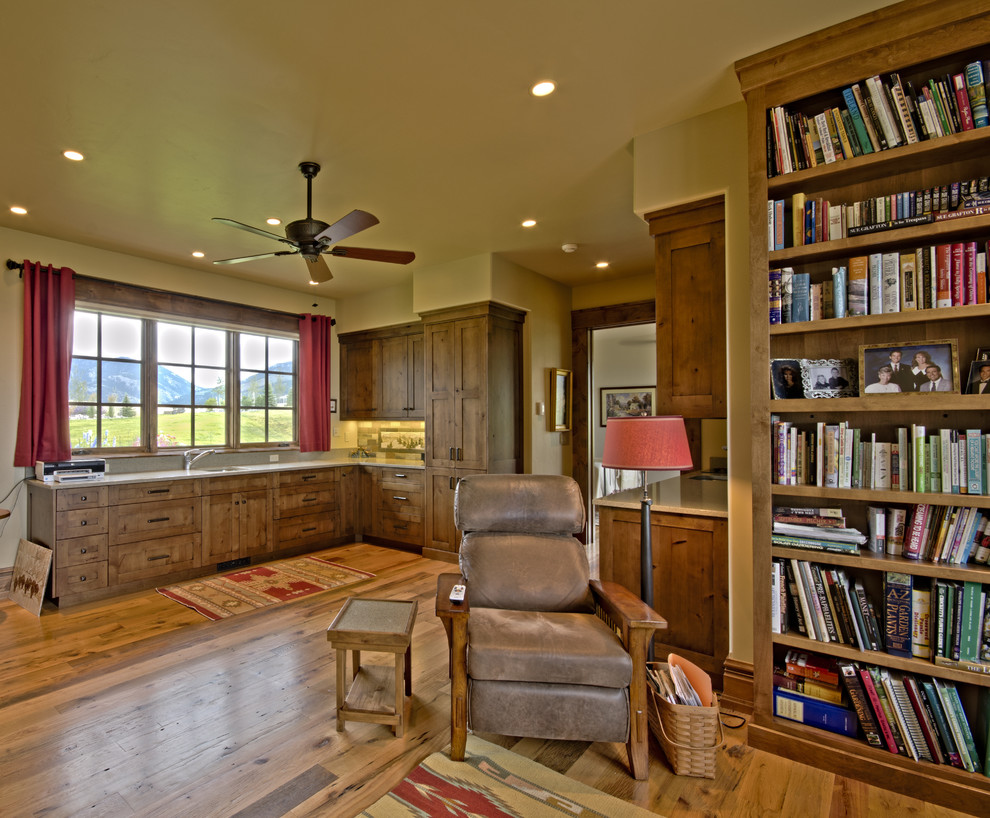 Photo of a country living room in Denver with a library.