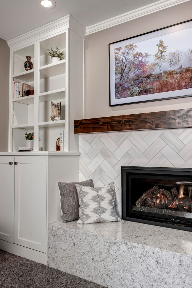 Medium sized traditional living room in Seattle with a reading nook, grey walls, carpet, a standard fireplace, a tiled fireplace surround, a wall mounted tv and grey floors.