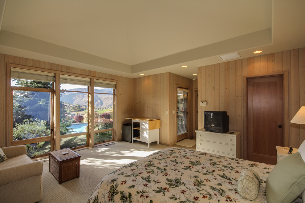 This is an example of a traditional bedroom in Seattle with carpet.