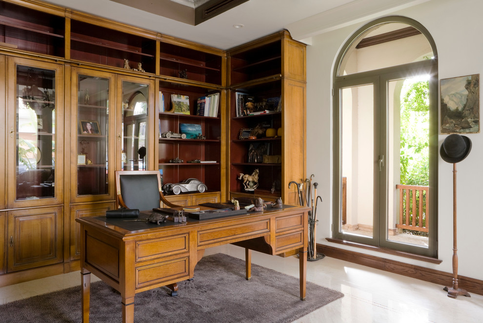 Photo of a traditional study room in London with white walls and a freestanding desk.