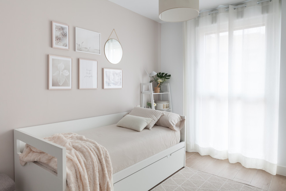 This is an example of a mid-sized scandinavian guest bedroom in Madrid with white walls, ceramic floors and brown floor.