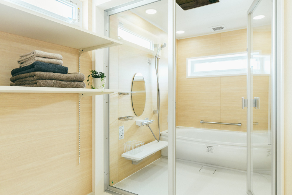 Mid-sized scandinavian master wet room bathroom in Other with glass-front cabinets, a hot tub, beige walls, white floor and a hinged shower door.
