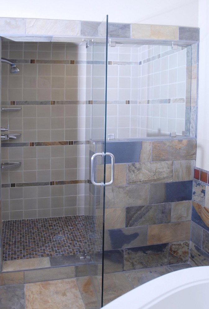 Design ideas for a large arts and crafts 3/4 bathroom in Denver with recessed-panel cabinets, dark wood cabinets, a freestanding tub, an alcove shower, a two-piece toilet, brown tile, slate, grey walls, slate floors, an undermount sink, concrete benchtops, brown floor, a hinged shower door and grey benchtops.