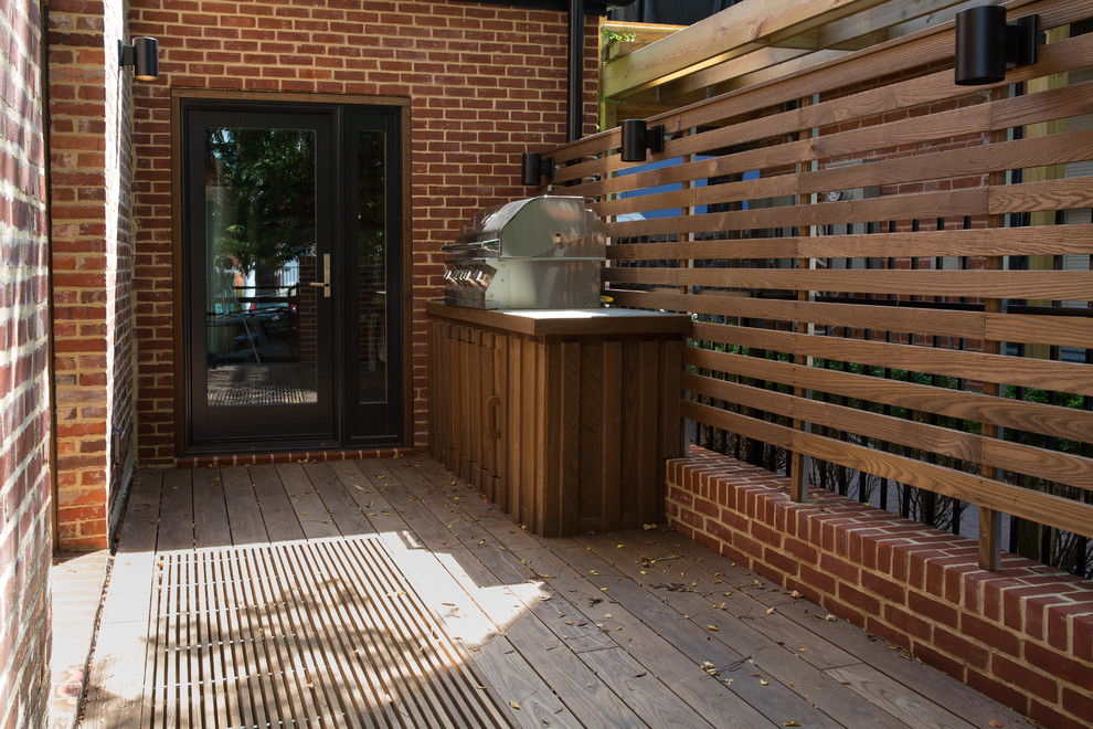 Inspiration for a small modern side yard deck in Baltimore with an outdoor kitchen and no cover.