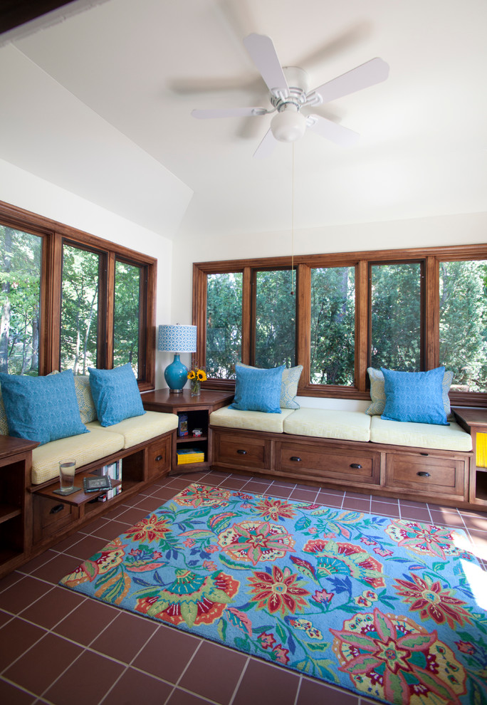 Photo of a mid-sized traditional sunroom in St Louis with ceramic floors, no fireplace, a standard ceiling and brown floor.