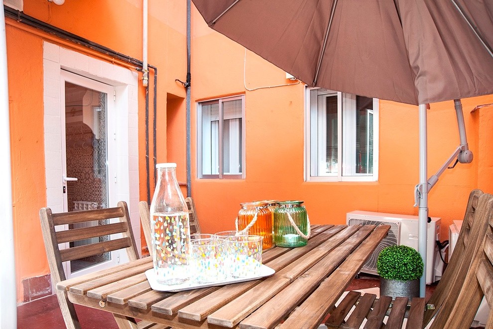 This is an example of a mid-sized scandinavian courtyard patio in Madrid with tile.