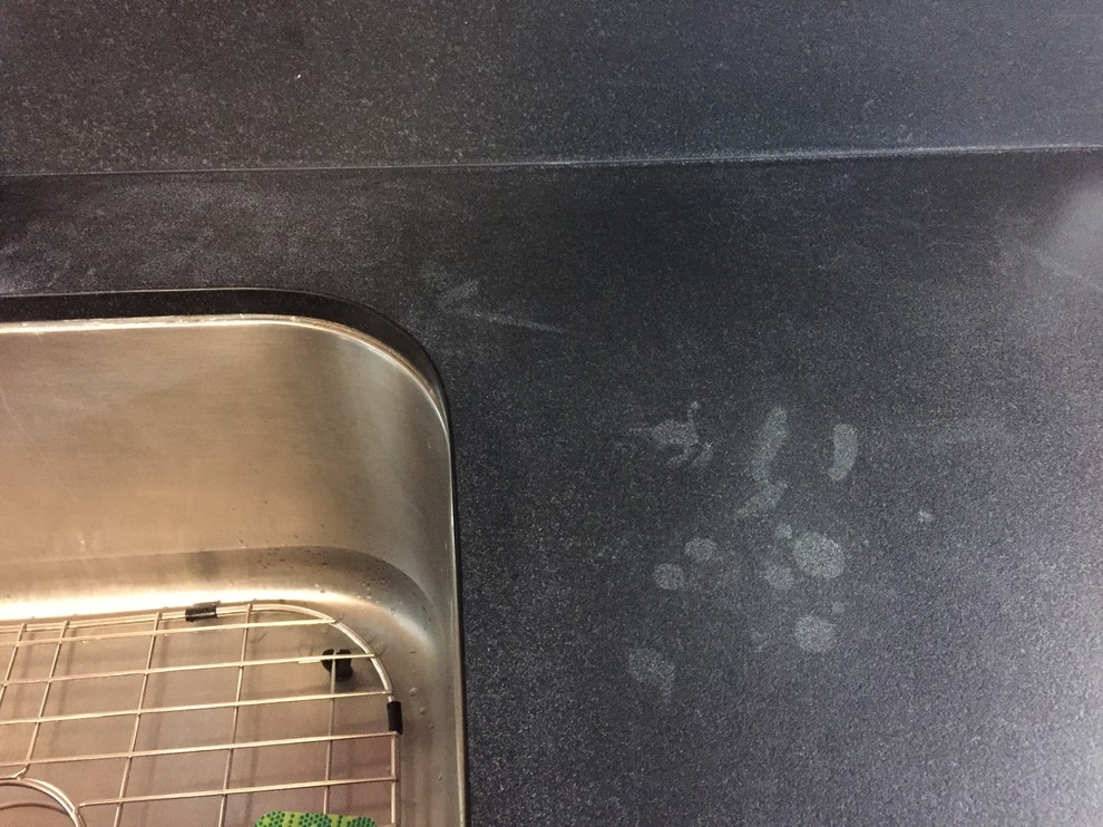 Help! So many white spots on my honed black granite...