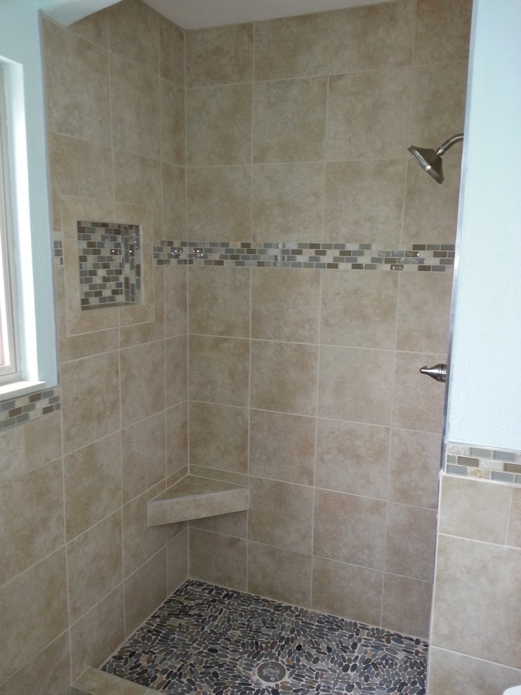 Example of a mid-sized transitional 3/4 beige tile and porcelain tile porcelain tile and beige floor alcove shower design with raised-panel cabinets, white cabinets, a two-piece toilet, blue walls, an undermount sink, laminate countertops, a hinged shower door and multicolored countertops