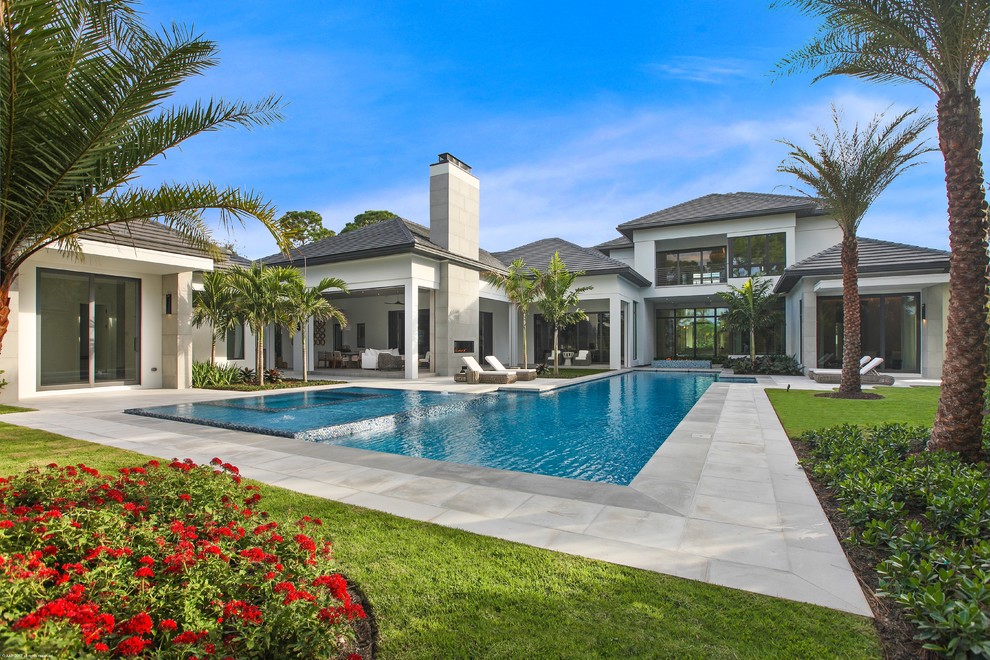 Island style pool photo in Miami