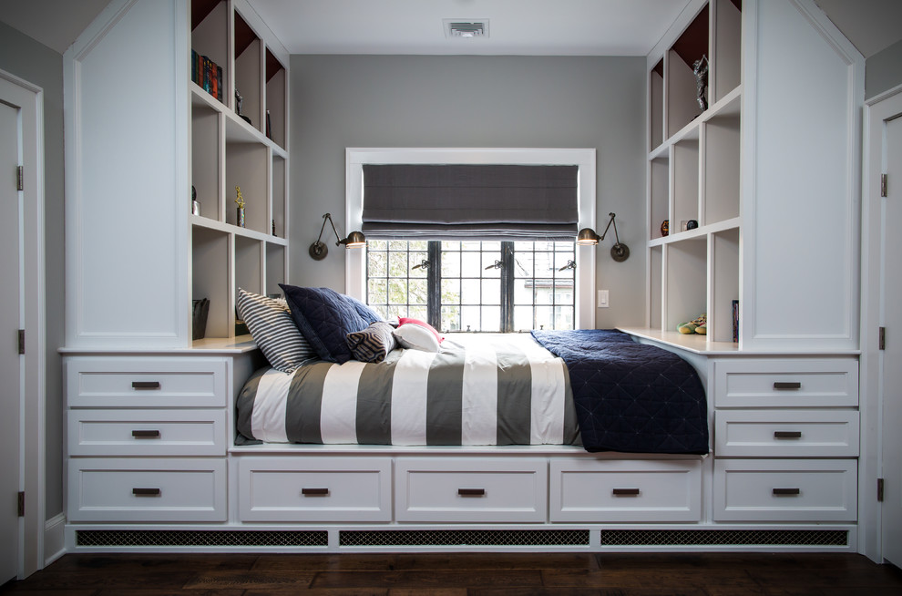 Transitional bedroom in New York with grey walls and dark hardwood floors.