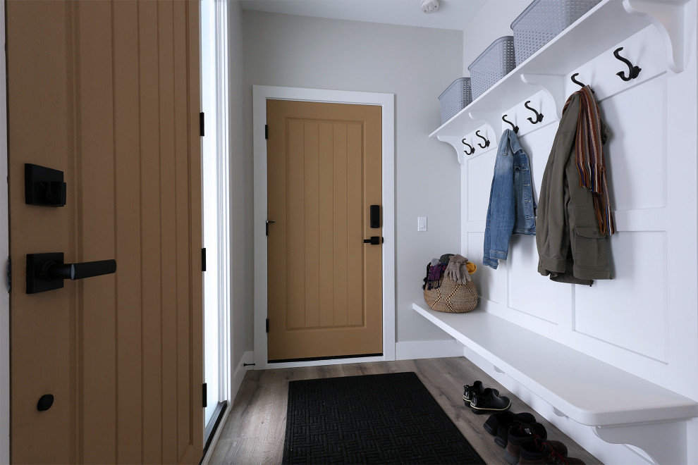 Modern boot room in Vancouver with brown walls, ceramic flooring, grey floors and tongue and groove walls.