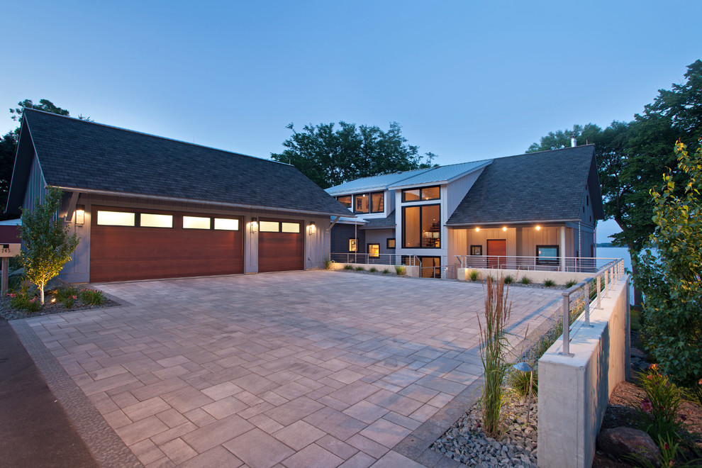 Contemporary two-storey grey exterior in Minneapolis with wood siding and a shed roof.