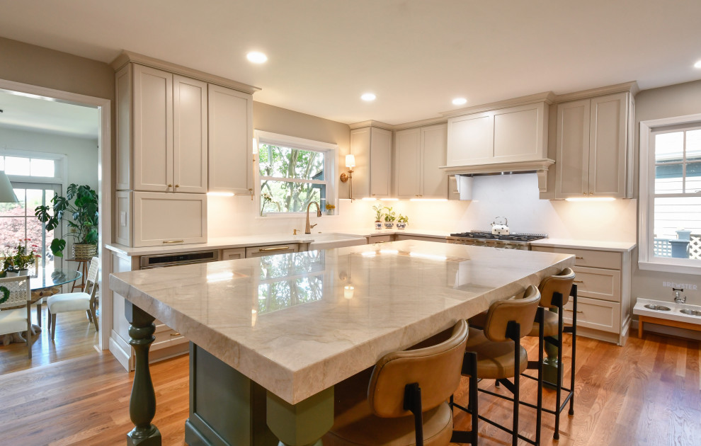 Inspiration for a huge transitional u-shaped enclosed kitchen remodel in DC Metro with a farmhouse sink, recessed-panel cabinets, quartz countertops, white backsplash, quartz backsplash, stainless steel appliances, an island and white countertops